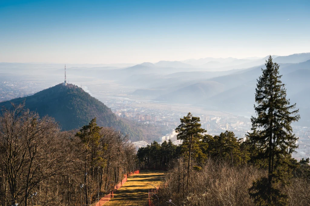 Aerial valley and hill view from a mountain town — discover Uttarakhand with the best travel agency in Uttarakhand