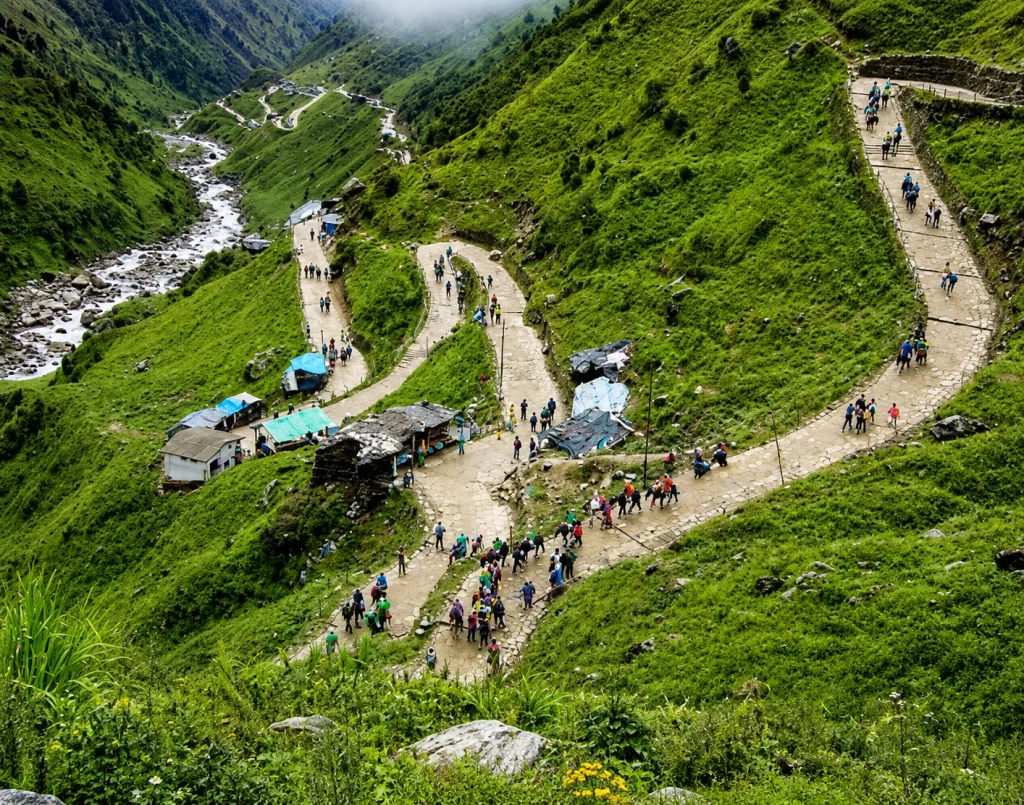 Green trekking trail to Kedarnath walked by pilgrims on the Char Dham Yatra package 2026