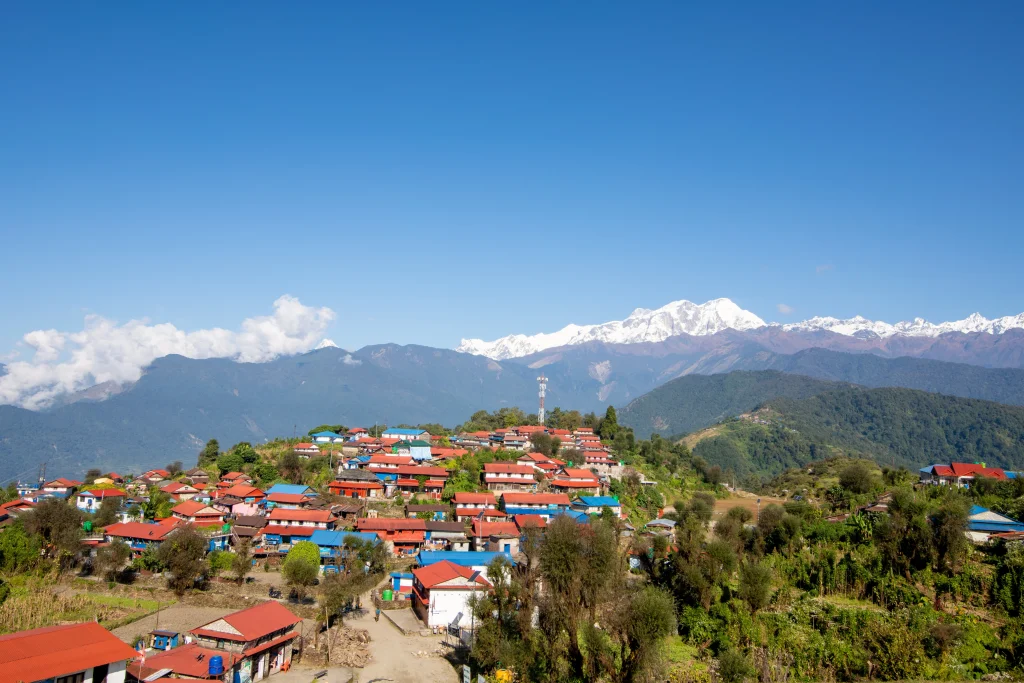 Colourful houses on Mussoorie hillsides included in the queen of hills Uttarakhand holiday package