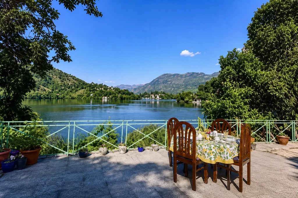 Naini lake ringed by hills and boats, the lake retreat Uttarakhand holiday package highlight