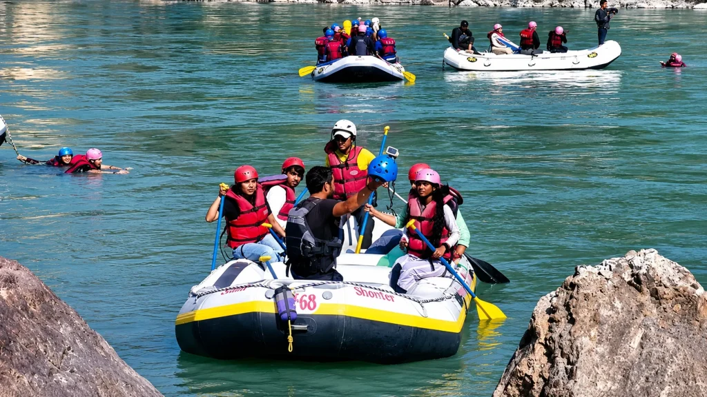 Smiling group rafting the Ganga, a safe activity suggested in our Uttarakhand family trip guide