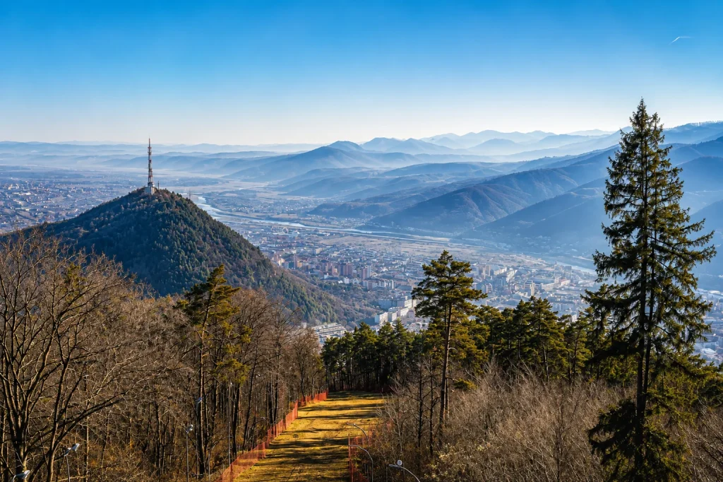 Aerial valley and hill view from a mountain town — discover Uttarakhand with the best travel agency in Uttarakhand